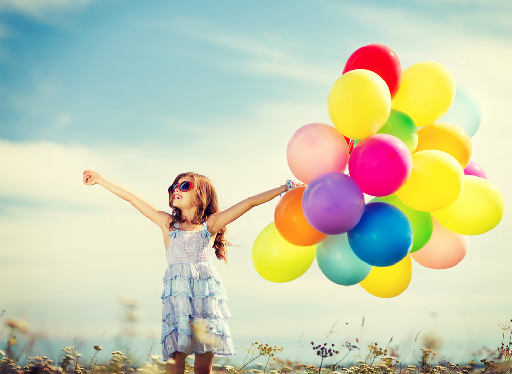 happy girl with colorful balloons
