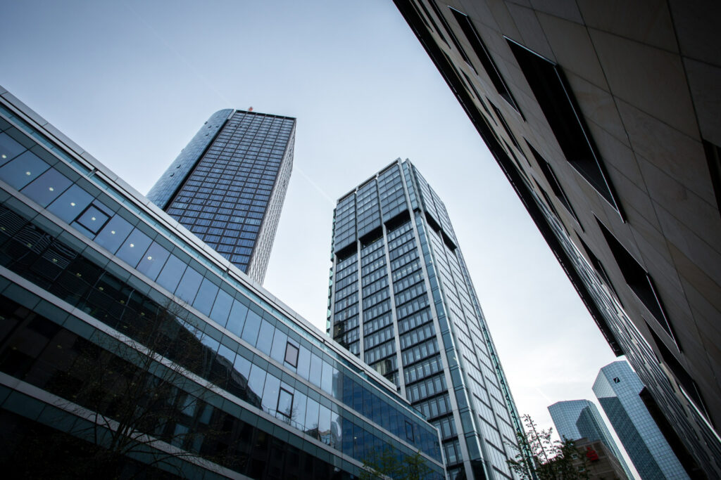 low-angle-shot-high-rise-buildings-clear-sky-frankfurt-germany