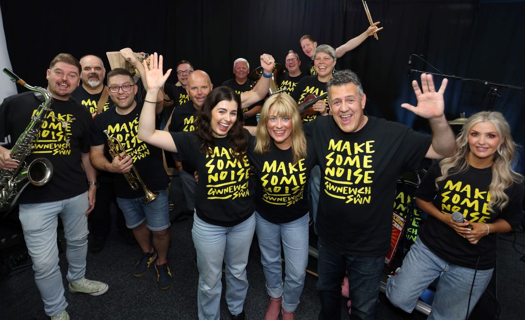 music 2 - make some noise band, front Rhys Meirion and daughter Elan with Head of Service Heather Powell