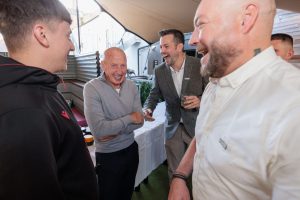 Mickey Thomas laughing with Howden team